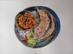 a painting of some food on a plate with lettuce and beans next to it