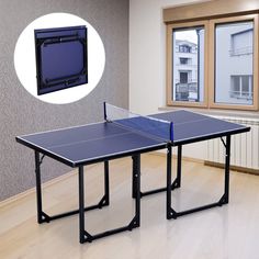 two ping pong tables in an empty room