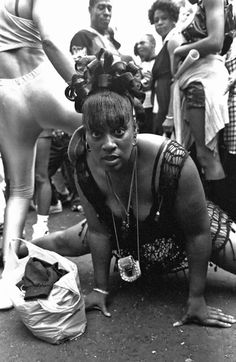 black and white photograph of woman on the ground surrounded by other women in bathing suits