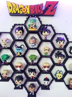 a bunch of action figures are arranged in a hexagonal pattern on the wall