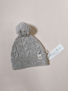 Introducing our delightful cable knit baby beanie, the perfect accessory to keep your little one cozy and stylish. Crafted with utmost care, this beanie is made from 100% Merino wool, ensuring exceptional warmth and comfort for your precious bundle of joy. Designed with a classic cable knit pattern, this beanie showcases a timeless style that complements any outfit. The intricate detailing adds a touch of sophistication to your baby's ensemble, making them the center of attention wherever they g Cozy Cable Knit Hats, Knitted Baby Beanies, Cable Knit Pattern, Toddler Education, Eco Friendly Christmas, Baby Bottoms, Mommy And Me Outfits, Special Occasion Outfits, Baby Warmer