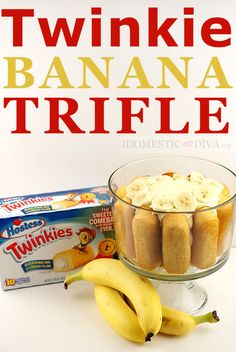 there is a banana trifle in a glass bowl next to two bananas and a box of twinkies