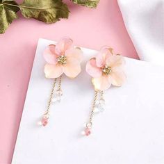 ♡ Hopeless Romantic Japanese Sakura Iridescent Stud Earrings ♡ Our Japanese Sakura Magic Bloom Studs are delicate and can easily be spotted as the iridescent drops dangle so beautifully! These dangling crystal drops are very light weight making your Japanese Sakura, the most famous flower in the land of the rising Sun, super comfy to wear. Perfect dainty costume jewelry gift for birthdays and special occasions. Size: 2 inch Material: alloy steel brass zinc Weight for 2: 0.4 oz W H Y ∙ Y O U ' L Gold Tassel Earrings, Iridescent Crystal, Pink Acrylics, Romantic Flowers, Party Earrings, Handmade Flower, Flower Fairy, Delicate Flower, Peach Pink