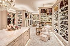 the closet is full of shoes and chandeliers