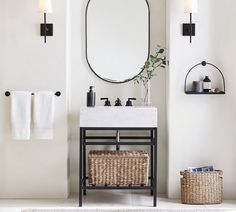 a bathroom with a sink, mirror and towel rack