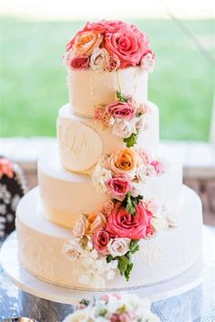 a three tiered cake with flowers on it