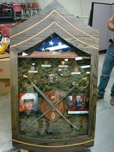 a clock made out of wood with pictures on it