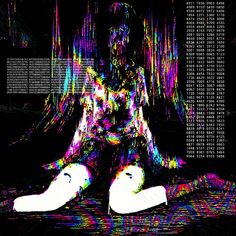 a person sitting on the ground in front of a black background with colorful lines and numbers