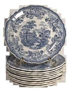 six blue and white plates stacked on top of each other