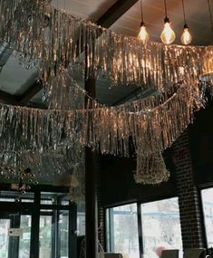 the chandelier is hanging from the ceiling in the restaurant's dining room