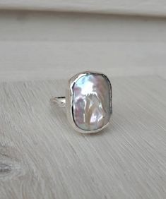 "This unique large Baroque pearl statement ring features a piece of genuine freshwater rectangle Baroque pearl sized about 15mm wide and 20mm long. The featured ring is already made in US size 8, only if you want to purchase the featured size 8 ring, you can choose \"size 8 ring\" in \"pearl choice\" and \"ring size\" options. Otherwise, and you can choose the pearl number from 1 to 6 in \"pearl choice\" option and choose your ring size in the \"ring size\" option. I will make the pearl ring wit Modern Silver Pearl Ring For Gifting, Modern Silver Pearl Ring As Gift, Baroque Pearl Ring, Unique Silver Rings, Freshwater Pearl Ring, Dope Jewelry, Funky Jewelry, Rings Cool, Rings For Her