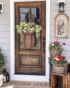 the front door is decorated with flowers and baskets