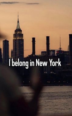 the words i belong in new york are overlaid with an image of a cityscape