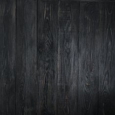 a black wood paneled wall with no one in it's place or furniture