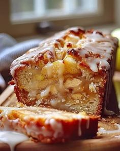 a loaf of cake sitting on top of a wooden cutting board