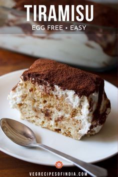 a piece of tiramu cake on a plate with a fork and spoon next to it