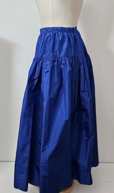 Full Length  Gathered  taffeta fabric  with a sewn in crinoline.  A formal style for the holidays or graduation vintage  1980's  lovely royal blue . Size  8  Waist  30"  Length 38"  back zipper no pockets. Photographed with a black velvet top  not included.  * Care  Dry Clean Only Blue Flared Gathered Skirt, Blue A-line Gathered Skirt, Graduation Vintage, Vintage Blue Skirt With Ruffles, Blue Voluminous Gathered Skirt, Luxury Blue Pleated Skirt, Relaxed Fit, Black Velvet Top, Taffeta Skirt, Taffeta Fabric