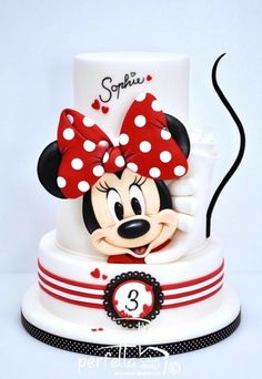 a minnie mouse cake with the number 3 on it's side and polka dots