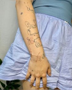 a woman with a tattoo on her arm