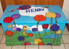 a blue box with the words henry painted on it's lid and palm trees