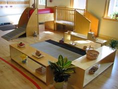 a living room filled with furniture and lots of wood flooring on top of a hard wood floor