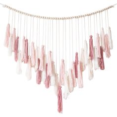 pink and white tassels hanging from a string