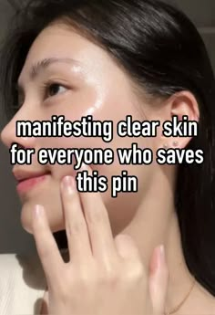 a woman holding her hand up to her face with the words manifesting clear skin for everyone who saves this pin