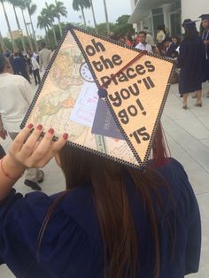 a woman wearing a graduation cap that reads, one the places you'll go