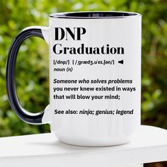 a black and white coffee mug with the words dnp graduation written on it