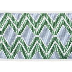 a blue and green chevroned ribbon with white thread on the end, in an embroidered pattern