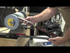 a man is using a machine to cut wood with a circular sawtoothing tool