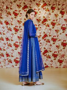 Editor's Note This set features a royal blue embroidered long kurta with dupatta and trouser. Color: Royal Blue Fabric: Silk Chnderi Brocade And Georgette Embroidery Details: Zardozi Care: Dry Clean Only Customize Your Outfit Can't find the size you're looking for? No stress. Just select the size "Custom" while adding the item to your cart. We will follow up with you for your body measurements. To request a color or design customizations, please contact our customer care by using our "Ask us a q Traditional Blue Sharara With Straight Kurta, Festive Blue Sharara With Straight Kurta, Blue Unstitched Sharara For Festive Occasions, Blue Sharara With Straight Kurta For Festive Occasions, Blue Palazzo Set With Pallu And Straight Kurta, Festive Blue Palazzo Set With Zari Work, Festive Blue Unstitched Sharara, Blue Zari Work Palazzo Set For Diwali, Blue Traditional Drape Sharara For Navratri