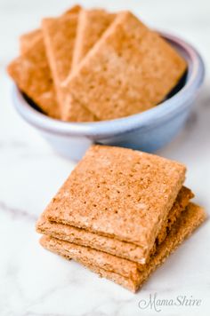 some crackers are in a bowl on a table