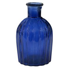 a blue glass vase sitting on top of a table