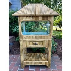 a small wooden stand with a glass window on it's top and bottom shelf