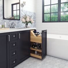 a bathroom with a sink, tub and cabinets in it's centerpieces