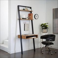 a chair and desk in a room with a ladder leaning up against the wall next to it