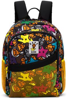 Canvas backpack in multicolor. · Graphic pattern printed throughout · Rolled webbing carry handle · Adjustable padded shoulder straps · Sternum strap · Logo patch at face · Zip and patch pocket at face · Mesh patch pocket at sides · Two-way zip closure · Fully lined · H14.5 x W10 x D4 Supplier color: Multi Bape Bookbags, Bape Backpack, Spray Ground Backpack, Cute Bookbags, Bape Bag, Y2k Backpack, Bape Star