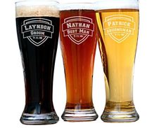 three different types of beer glasses with the names of their beers in each mugs