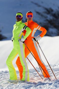 two men in ski gear standing next to each other