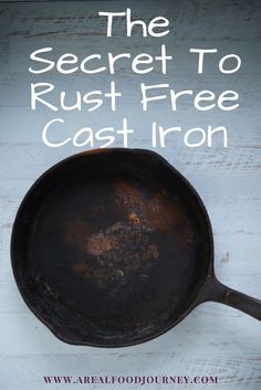 an old cast iron skillet with the words, the secret to rust free cast iron