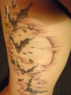 the back of a woman's leg with bats on it