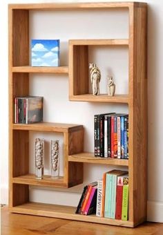 a wooden shelf with books and other items on it