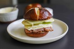 a sandwich with meat and cheese on a plate