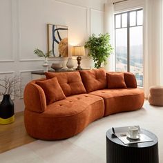 a living room filled with furniture and a large window