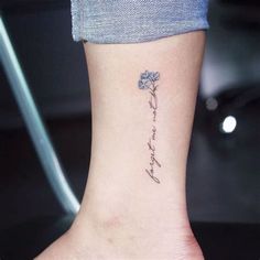 a small tattoo on the ankle that says, i love you