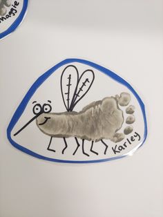 an insect sticker on the side of a refrigerator