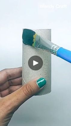 a person is holding a cup with a toothbrush in it and the video below shows how to use an electric toothbrush