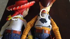 there are two toy figures that look like they're wearing cowboy hats and boots