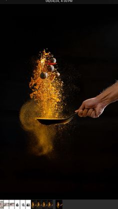 a person is holding a spoon with some food on it and the image appears to be exploding